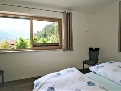 Ein Bett oder Betten in einem Zimmer der Unterkunft Apartment Gerlosstein Blick by Interhome