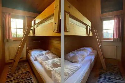 Ein Bett oder Betten in einem Zimmer der Unterkunft Kosbacher Hütte