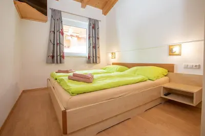 Ein Bett oder Betten in einem Zimmer der Unterkunft Chalet Central Top CC 7