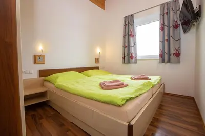 Ein Bett oder Betten in einem Zimmer der Unterkunft Chalet Central Top CC 7