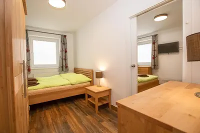 Ein Bett oder Betten in einem Zimmer der Unterkunft Chalet Hirsch