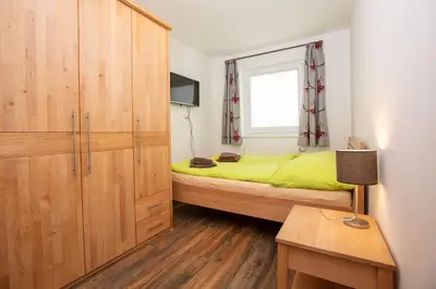 Ein Bett oder Betten in einem Zimmer der Unterkunft Chalet Hirsch