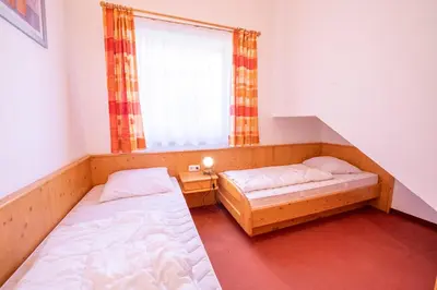 Ein Bett oder Betten in einem Zimmer der Unterkunft Am Edelweißanger Haus A Top 7