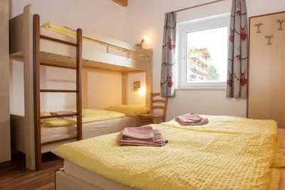 Ein Bett oder Betten in einem Zimmer der Unterkunft Chalet Central Top CC 5