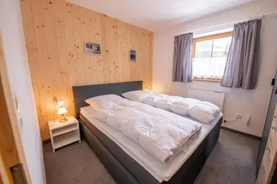 Ein Bett oder Betten in einem Zimmer der Unterkunft Appartement Fürler UG