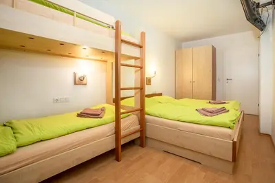 Ein Bett oder Betten in einem Zimmer der Unterkunft Chalet Central Top CC 1