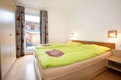 Ein Bett oder Betten in einem Zimmer der Unterkunft Chalet Central Top CC 6