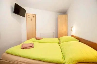 Ein Bett oder Betten in einem Zimmer der Unterkunft Chalet Central Top CC 6