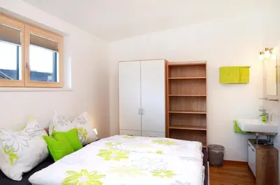 Ein Bett oder Betten in einem Zimmer der Unterkunft Haus Höllerer