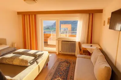 Ein Bett oder Betten in einem Zimmer der Unterkunft Pension Waldegg