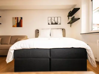 Ein Bett oder Betten in einem Zimmer der Unterkunft Hoffie und Prost