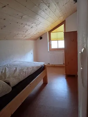 Ein Bett oder Betten in einem Zimmer der Unterkunft Ferienwohnung Maier