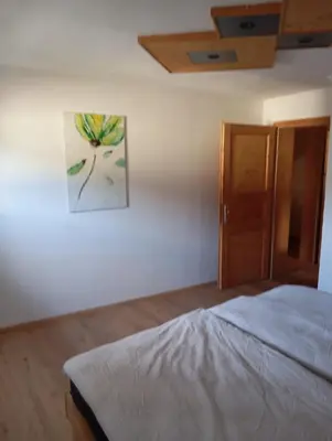 Ein Bett oder Betten in einem Zimmer der Unterkunft Ferienwohnung Maier