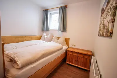 Ein Bett oder Betten in einem Zimmer der Unterkunft Ferienwohnung Königsleiten 121b - Top 2