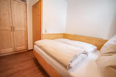 Ein Bett oder Betten in einem Zimmer der Unterkunft Ferienwohnung Königsleiten 121b - Top 2