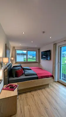 Ein Bett oder Betten in einem Zimmer der Unterkunft Penzhaus - Premium Private Suites