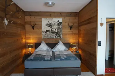 Ein Bett oder Betten in einem Zimmer der Unterkunft Wohlfühlstudio Bergblick in Walchsee