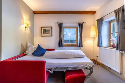 Ein Bett oder Betten in einem Zimmer der Unterkunft Gasthof Auwirt in Aurach