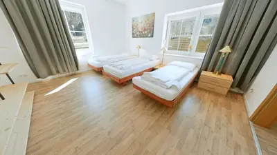 Ein Bett oder Betten in einem Zimmer der Unterkunft Alpenlodge, Ferienwohnung 1