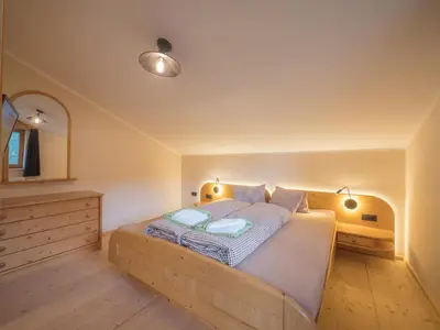 Ein Bett oder Betten in einem Zimmer der Unterkunft Pension Sonderbichlhof