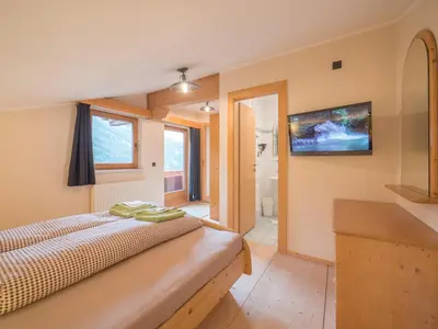 Ein Bett oder Betten in einem Zimmer der Unterkunft Pension Sonderbichlhof