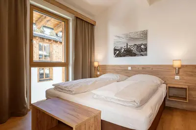 Ein Bett oder Betten in einem Zimmer der Unterkunft Bergresort Tauernblick by ALPS RESORTS