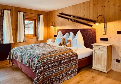 Ein Bett oder Betten in einem Zimmer der Unterkunft ALPIN CHARME APARTMENTS Tonis cozy Boutique Apartment