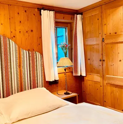 Ein Bett oder Betten in einem Zimmer der Unterkunft ALPIN CHARME APARTMENTS Tonis cozy Boutique Apartment