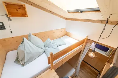 Ein Bett oder Betten in einem Zimmer der Unterkunft klein und fein wohnen OM