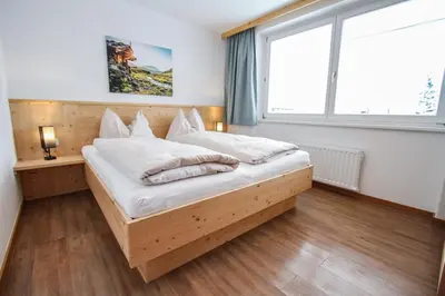 Ein Bett oder Betten in einem Zimmer der Unterkunft Ferienwohnung Königsleiten 121b - Top 1