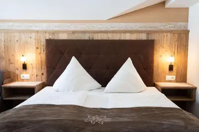 Ein Bett oder Betten in einem Zimmer der Unterkunft Pension Edelweiss