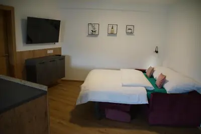 Ein Bett oder Betten in einem Zimmer der Unterkunft Apart Elina