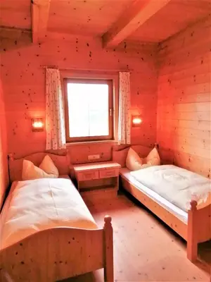 Ein Bett oder Betten in einem Zimmer der Unterkunft Ferienwohnung Bergblick