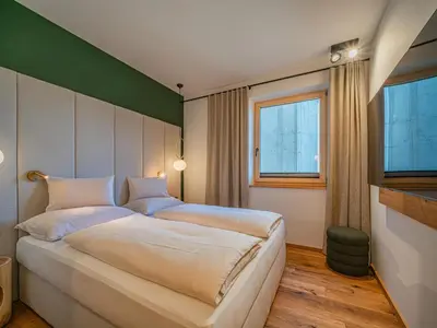 Ein Bett oder Betten in einem Zimmer der Unterkunft Premium Apartment Almrausch