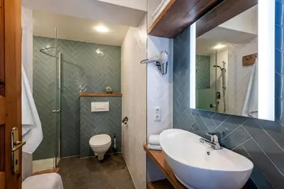 Ein Badezimmer in der Unterkunft Haus Den Rappen