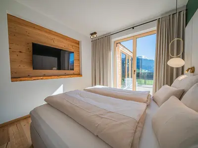 Ein Bett oder Betten in einem Zimmer der Unterkunft Premium Apartment Sunnseit