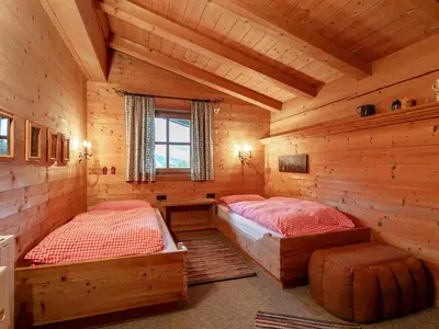 Ein Bett oder Betten in einem Zimmer der Unterkunft Chalet Rettensteinblick
