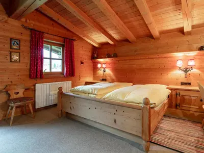 Ein Bett oder Betten in einem Zimmer der Unterkunft Chalet Rettensteinblick