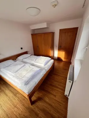 Ein Bett oder Betten in einem Zimmer der Unterkunft Apartmenthaus Ferdinand
