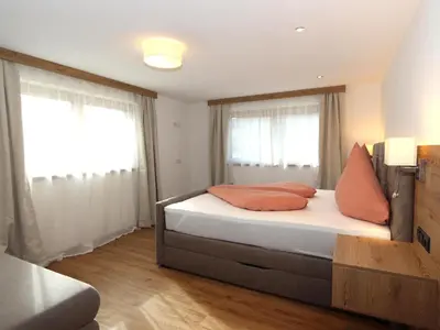 Ein Bett oder Betten in einem Zimmer der Unterkunft Apartment Hollaus