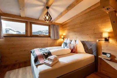 Ein Bett oder Betten in einem Zimmer der Unterkunft Lodge Kitzbüheler Alpen