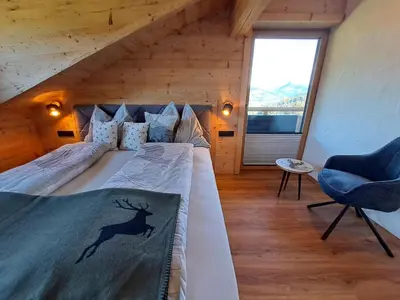 Ein Bett oder Betten in einem Zimmer der Unterkunft Lodge Kitzbüheler Alpen