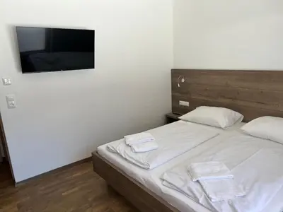 Ein Bett oder Betten in einem Zimmer der Unterkunft Merwede Wasserfallblick