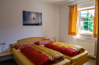 Ein Bett oder Betten in einem Zimmer der Unterkunft Reichenspitzblick Appartement