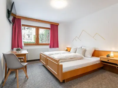 Ein Bett oder Betten in einem Zimmer der Unterkunft Apart An der Ache