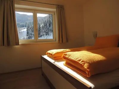 Ein Bett oder Betten in einem Zimmer der Unterkunft Z`Aglers Ferienwohnungen