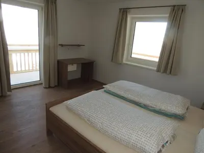 Ein Bett oder Betten in einem Zimmer der Unterkunft Z`Aglers Ferienwohnungen