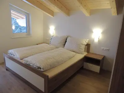 Ein Bett oder Betten in einem Zimmer der Unterkunft Z`Aglers Ferienwohnungen