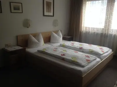 Ein Bett oder Betten in einem Zimmer der Unterkunft Ferienwohnung Blumen Penz