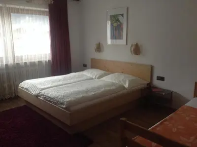Ein Bett oder Betten in einem Zimmer der Unterkunft Ferienwohnung Blumen Penz